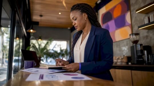 Businesswoman reviewing marketing alignment documents
